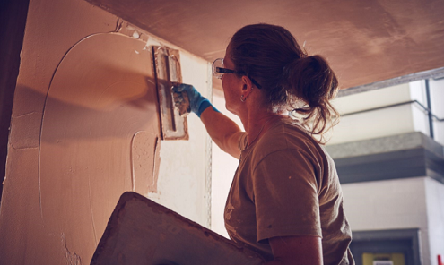 Woman plastering