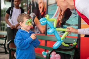 Boy with balloon animal at Rainham Leisure Centre