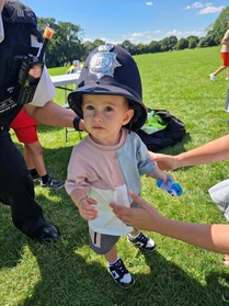 Boy in police hat