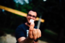 Man holding up a SIM card