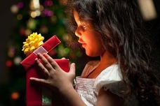Child opening a Christmas present