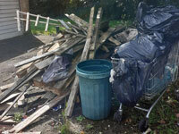 Image of a pile of decking wood and other rubbish