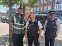 Metropolitan Police officers with a council parking enforcement officer