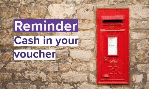 Post Officer letterbox on wall with text Reminder: cash in your voucher