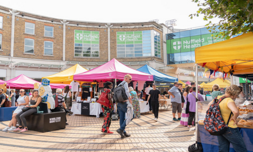 Stalls and people on Wimbledon Piazza