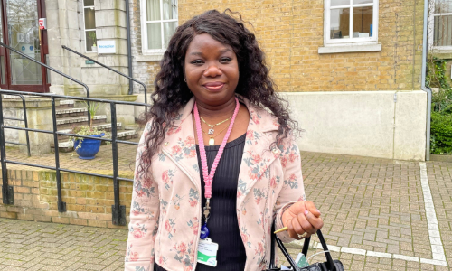 Ethel Odia, a member of Merton's safeguarding team, outside a building