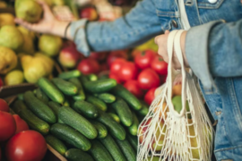 woman buying produce in a shop