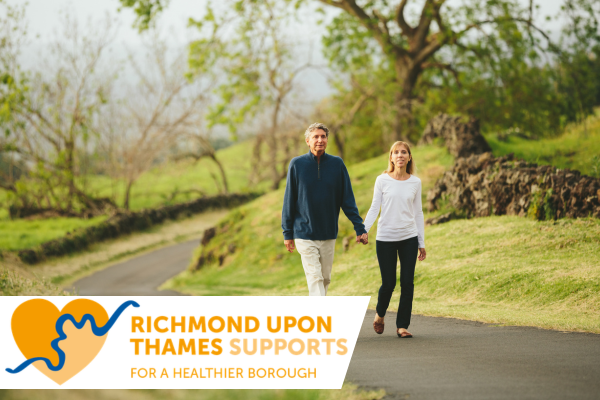 two people walking on a path