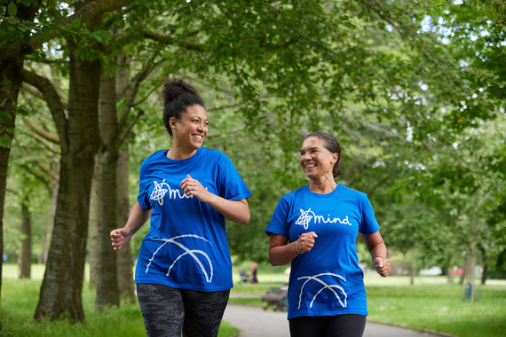 two women walking in blue tshirts