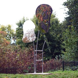 Reflected Perspective sculpture in battersea park - 3 contorted mirror panels are held up in the air by metal poles