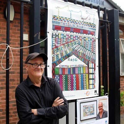 Ian wornast in front of abstract drawings 