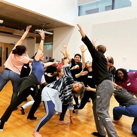 group of people stretching together