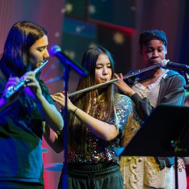 young people playing musical instruments
