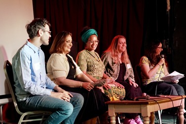 Members of a panel at the Re-Create Launch and Learn event on stage