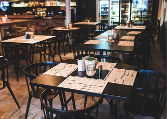 Picture of an empty venue with tables and chairs 