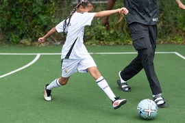 child playing football