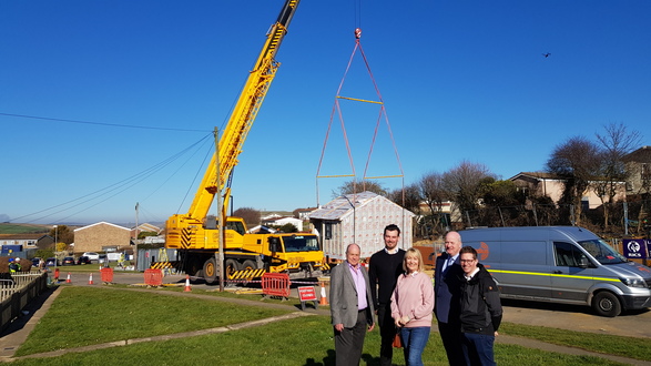 One of the homes being moved into position