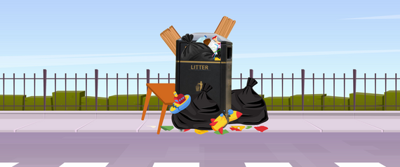 rubbish bin overflowing with black sacks