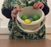 bucket containing colourful balls