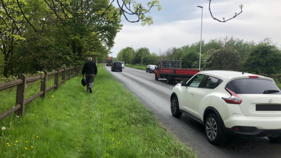 A6120 Outer Ring Road with pedestrian on grass verge