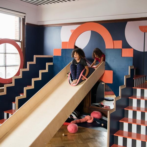 A child on a slide in an indoor play area