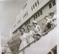 A black and white image of several ladies leaving a cruise ship