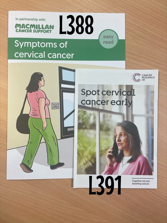 Two booklets are shown which include symptoms of cervical cancer