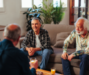 People sat talking on a sofa