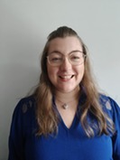 Picture of a woman smiling at the camera 