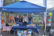 Colleagues standing in a gazebo