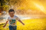Boy being splashed