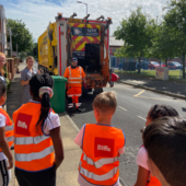 Biffa giving local school children a tour of the electric bin vans