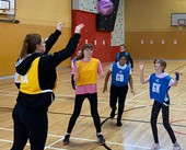 Young people playing netball