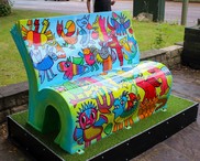 muliti coloured bench shaped like a book