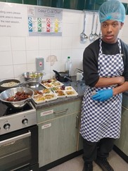 Young person in kitchen with food