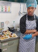Young person in kitchen with food
