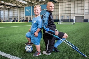 Disabled footballer and disabled boy