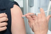 flu jab being put in an arm