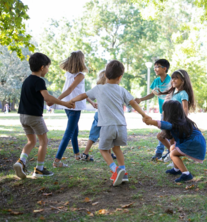 Happy children playing together outdoors
