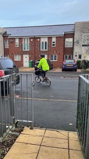 person on a bike with high vis 