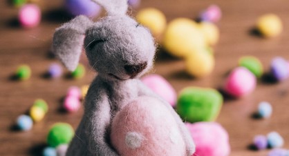 Easter bunny holding egg