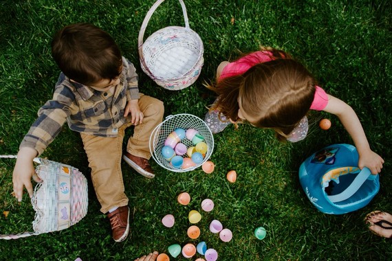 Children playing with Easter eggs and baskets
