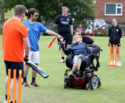 Disabled young people playing cricket