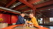 Two children enjoy a display at the Science and Industry Museum