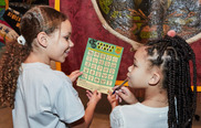 Two children playing Banner Bingo at the People's History Museum
