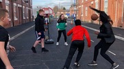 A group of children playing baksetball