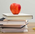 School books and apple