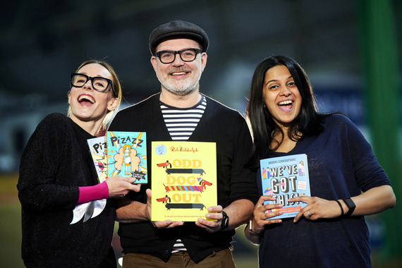 Authors Sophy Henn, Rob Biddulph and Rashmi Sirdishpande smiling and holding up their books.