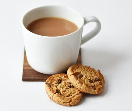 Coffee cup and biscuit