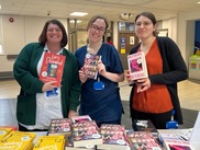 Three members of staff at Th Christie, holding books